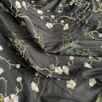 Longan Craft’s Chinoiserie Embroidered Silk Fabric By The Yard blends cotton and mulberry silk, featuring white and yellow floral embroidery with green leaves and blue accents—a premium fabric perfect for blouses.
