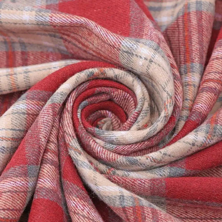Close-up of Longan Craft’s Christmas Plaid Sueded Flannel Fabric By The Yard, featuring a classic red, beige, and gray checked design neatly twisted into a spiral to highlight its soft texture and woven flannel pattern—perfect for holiday sewing or crafting projects.