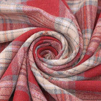 Close-up of Longan Craft’s Christmas Plaid Sueded Flannel Fabric By The Yard, featuring a classic red, beige, and gray checked design neatly twisted into a spiral to highlight its soft texture and woven flannel pattern—perfect for holiday sewing or crafting projects.