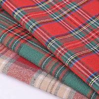 Three neatly folded pieces of Longan Craft’s Christmas Plaid Sueded Flannel Fabric by the Yard, in classic red, green, and beige checkered patterns. Each piece features traditional plaid designs with intersecting lines in festive holiday colors—perfect for sewing cozy Christmas projects or creating timeless flannel dresses with this premium checked holiday flannel textile.