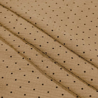 Longan Craft’s Classic Small Polka Dot Gauze Fabric by the yard is 100% cotton double gauze with brown crinkled texture and black polka dots, perfect for baby clothing or pajamas. Shown in shallow folds.