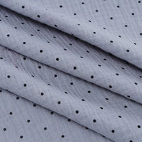 Longan Craft's Classic Small Polka Dot Gauze Fabric By The Yard—100% cotton double gauze with evenly spaced black dots—is perfect for baby clothing and pajamas.