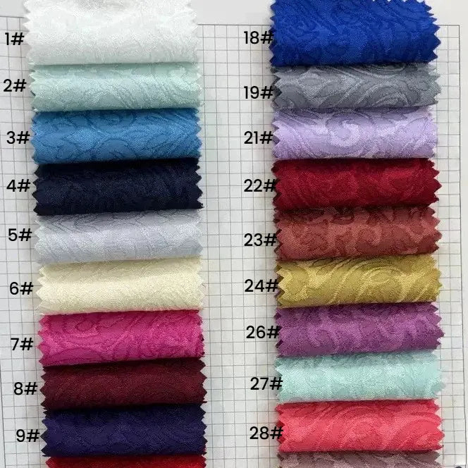 Twenty-eight swatches of Longan Craft’s Colorful Brocade Damask Fabric By The Yard, labeled 1#–28#, showcase patterned jacquard damask—perfect for upholstery or as damask dress material.