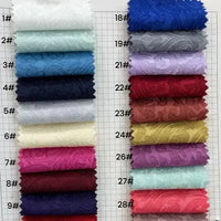 Twenty-eight swatches of Longan Craft’s Colorful Brocade Damask Fabric By The Yard, labeled 1#–28#, showcase patterned jacquard damask—perfect for upholstery or as damask dress material.