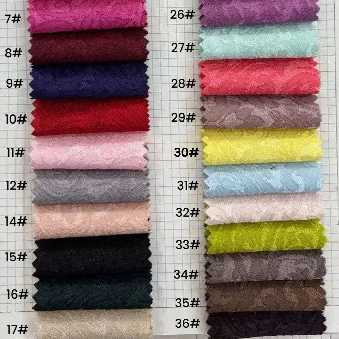 Longan Craft’s Colorful Brocade Damask Fabric by the yard features patterned jacquard damask in darker tones on the left and lighter pastels on the right, making it ideal for unique upholstery or damask dress material.