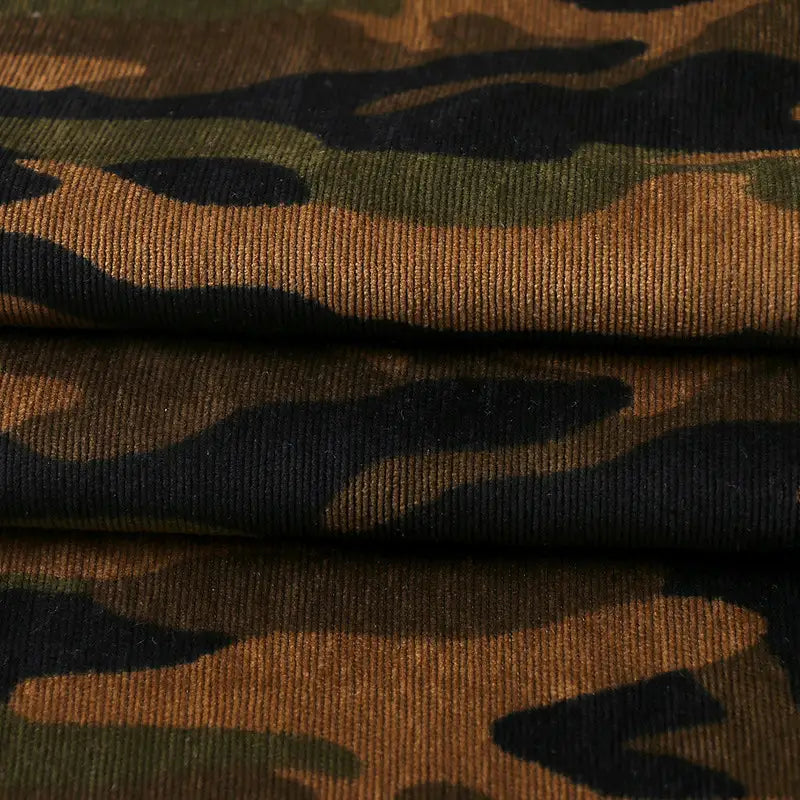 Close-up of Longan Craft’s Colorful Camouflage Corduroy Fabric by the yard, showcasing its green, brown, and black military-style print and textured quality—ideal for clothing and crafted from premium material.