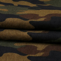Close-up of Longan Craft’s Colorful Camouflage Corduroy Fabric by the yard, featuring classic green, brown, and black shades. This quality camouflage printed corduroy is ideal for clothing with its soft, woven texture.