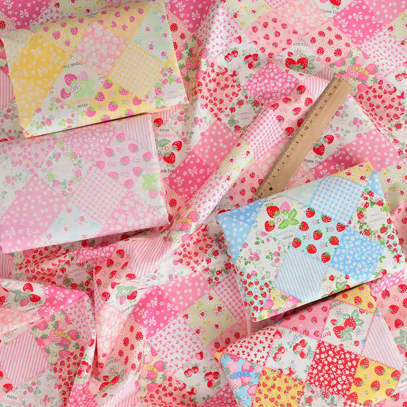 The Longan Craft Colorful Checked Floral Poplin Fabric by the yard features a vibrant patchwork of strawberries, polka dots, checks, and florals in pink, yellow, and blue—a perfect cotton poplin textile for garments.