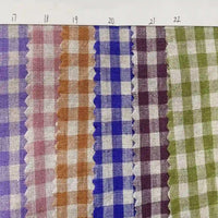 Six swatches of the Longan Craft Colorful Checkered Linen Fabric By The Yard, each in a different color and numbered 17 through 22 from left to right, are displayed in a row on a white background, with their zigzag-cut edges clearly visible. This 100% washed linen gingham fabric is ideal for dressmaking and other sewing projects.
