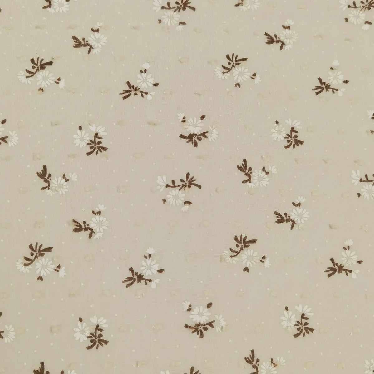 Longan Craft's Colorful Daisy Print Swiss Dot Fabric by the yard is 100% cotton with a soft dotted texture and features vibrant flower prints, making it a breathable choice for casual wear.