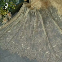 Longan Craft's Colorful Floral Embroidered Lace Fabric By The Yard features a vintage scalloped edge and botanical pattern. The delicate wedding gown lace material is displayed with soft folds, while white and yellow flowers appear in the upper left corner, near the number 9.