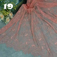 Longan Craft’s Colorful Floral Embroidered Lace Fabric by the yard, a vintage scalloped lace with botanical patterns, is displayed beside white and yellow flowers. The number 19 appears in bold white text on the upper left.