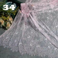 Colorful Floral Embroidered Lace Fabric by Longan Craft is displayed on a gray surface with dried flowers in a green box. The number 34 is shown in bold white text at the top left. Perfect for wedding gowns and vintage projects.