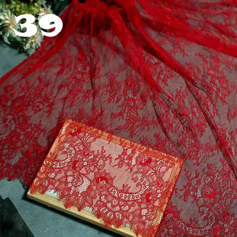 Longan Craft’s Colorful Floral Embroidered Lace Fabric by the yard, featuring a vintage scalloped botanical pattern, is draped and folded on a wooden board with the number 39 in white text at the top left.