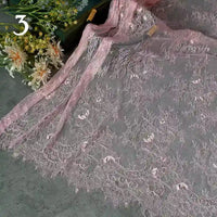 Longan Craft’s Colorful Floral Embroidered Lace Fabric by the yard, featuring a vintage scalloped botanical pattern, is displayed on a gray surface with white and yellow flowers in the background and the number 3 at the top left.