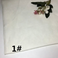 A piece of Colorful Lightweight Ramie Fabric by Longan Craft, in a solid white color, featuring artificial flowers in the top right corner and the text “1#” in bold black font at the bottom left.