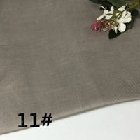 A swatch of Colorful Lightweight Ramie Fabric by the yard from Longan Craft is shown in light brown with a subtle diagonal texture. Small white and pink flowers accent the top right corner, while “11#” is displayed in bold black text at the bottom left.