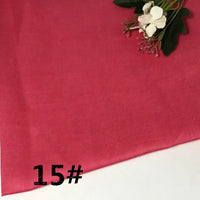 A piece of vibrant pink Colorful Lightweight Ramie Fabric By The Yard from Longan Craft is shown, with a small floral arrangement in the top right corner. The number 15# appears in bold black text on the lower left of the soft, solid color pure ramie material.