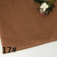 Brown corduroy fabric featuring artificial flowers in the top right corner and the number 17# in black at the bottom left, complemented by a touch of Longan Craft’s Colorful Lightweight Ramie Fabric By The Yard for added vibrance and texture.