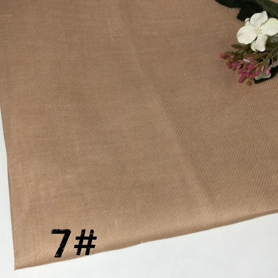 A piece of Colorful Lightweight Ramie Fabric By The Yard by Longan Craft, labeled 7#, featuring floral designs in the upper right corner on a white background.