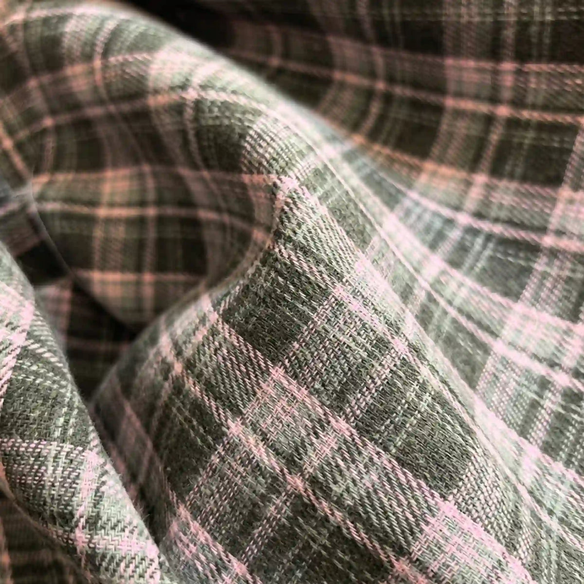 Close-up of the Longan Craft Colorful One Side Sueded Flannel Fabric By The Yard, a yarn-dyed cotton plaid flannel featuring a soft, super snuggle fall material with green and pink checks, highlighting the fabric’s brushed texture and gentle folds.