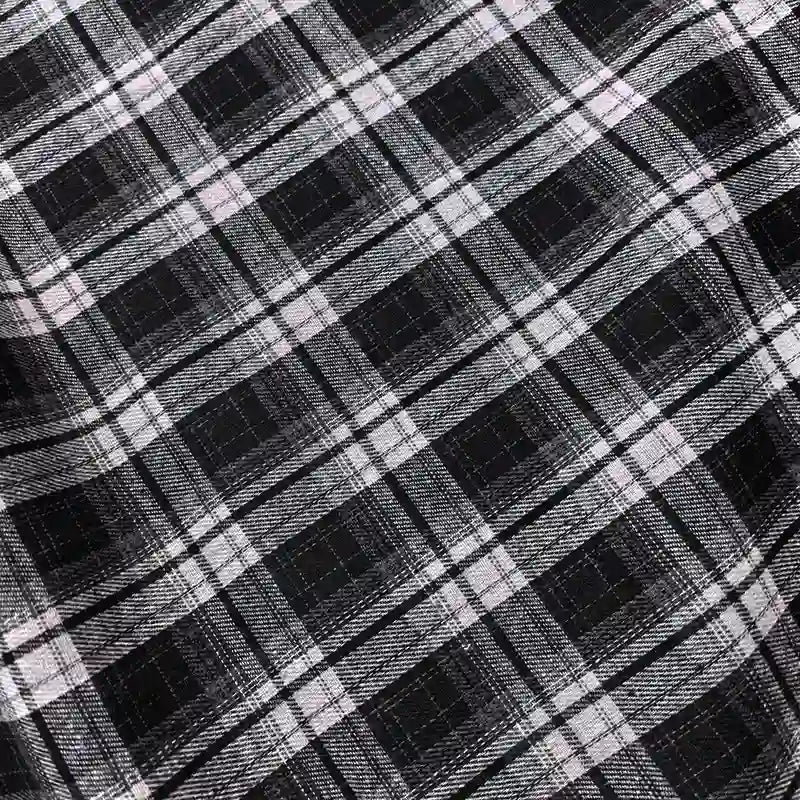Experience the cozy texture of Longan Craft’s Colorful One Side Sueded Flannel Fabric by the Yard—a yarn dyed cotton plaid with a classic black, white, and gray crisscross pattern of large and small squares. The brushed flannel features visible diagonal lines and super snuggly fall softness, perfect for your next project.