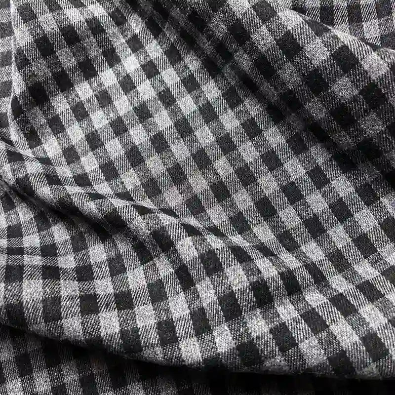 Close-up of Longan Craft’s Colorful One Side Sueded Flannel Fabric By The Yard, a yarn-dyed cotton plaid flannel with a super snuggle texture and visible folds.