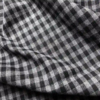 Close-up of Longan Craft’s Colorful One Side Sueded Flannel Fabric By The Yard, a yarn-dyed cotton plaid flannel with a super snuggle texture and visible folds.