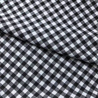A close-up of Longan Craft Colorful One Side Sueded Flannel Fabric by the yard, featuring a yarn-dyed cotton plaid pattern with an overlapping fold in the center of the image, highlighting the super snuggle flannel material.