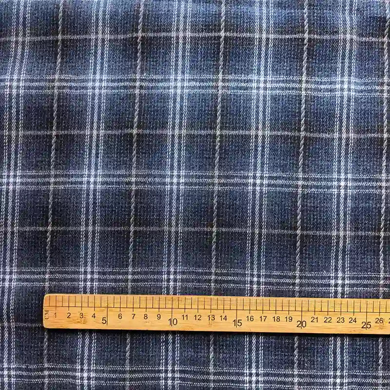 The image shows the Longan Craft Colorful One Side Sueded Flannel Fabric by the Yard, featuring a yarn dyed cotton plaid pattern in blue with white lines forming squares. A wooden ruler is placed horizontally at the bottom, measuring approximately 30 centimeters.