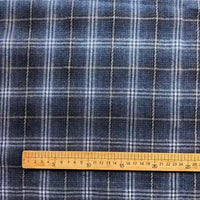 The image shows the Longan Craft Colorful One Side Sueded Flannel Fabric by the Yard, featuring a yarn dyed cotton plaid pattern in blue with white lines forming squares. A wooden ruler is placed horizontally at the bottom, measuring approximately 30 centimeters.