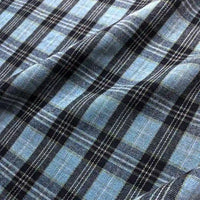 Longan Craft Colorful One Side Sueded Flannel Fabric by the Yard features a blue and black yarn-dyed cotton plaid design with crisp white lines forming a checkered pattern. This super snuggle fall flannel material boasts a slightly wrinkled, textured finish, ideal for cozy projects.