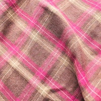 A close-up of Longan Craft’s Colorful One Side Sueded Flannel Fabric By The Yard, a yarn dyed cotton plaid flannel featuring pink and beige tones, with a soft, textured surface and visible creases—perfect for super snuggle fall projects.