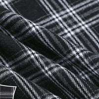 Close-up of the “Colorful One Side Sueded Flannel Fabric By The Yard” by Longan Craft, a yarn dyed cotton plaid flannel fabric. The super snuggle fall material features a black and white checkered pattern with visible texture and softness, highlighted by gentle folds in the fabric.