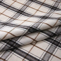 Folded Longan Craft “Colorful One Side Sueded Flannel Fabric By The Yard”—a super snuggle, yarn-dyed cotton plaid flannel—features a soft, layered material with a checkered beige, brown, and black pattern on a white background.