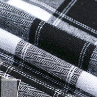 Close-up of Longan Craft’s Colorful One Side Sueded Flannel Fabric by the yard, a yarn dyed cotton plaid flannel from their Super Snuggle Fall collection, showing black, white, and gray woven patterns with herringbone and solid sections for enhanced texture and detail.