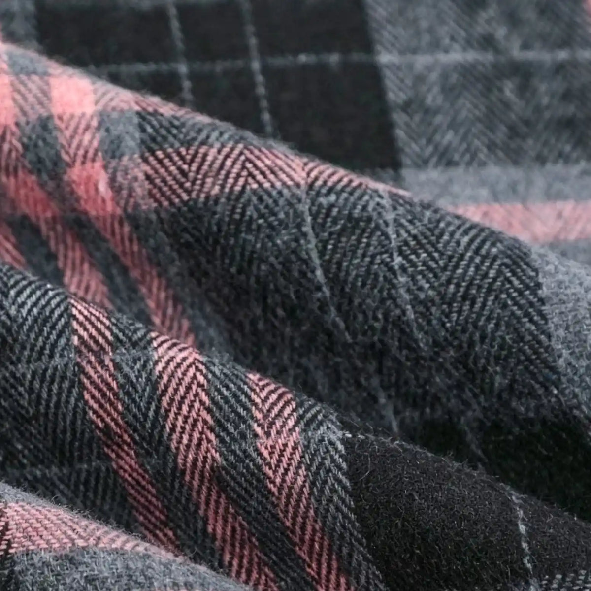 Close-up of Longan Craft’s Colorful One Side Sueded Flannel Fabric By The Yard, a super snuggle fall material featuring a yarn dyed cotton plaid pattern in pink, black, and gray. The fabric shows its cozy texture and soft folds.