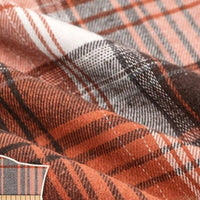 Close-up of the Colorful One Side Sueded Flannel Fabric by Longan Craft, featuring a yarn-dyed cotton plaid in orange, brown, white, and black with intersecting lines and a soft, textured surface—perfect for super snuggly fall projects.