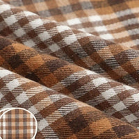 Colorful One Side Sueded Flannel Fabric By The Yard from Longan Craft is a yarn-dyed cotton plaid flannel featuring brown, tan, and white intersecting horizontal and vertical lines in a checkered design. The super snuggle fall material is shown folded to highlight its soft, one side sueded texture in close-up detail.