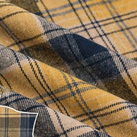 Close-up of Longan Craft’s Colorful One Side Sueded Flannel Fabric By The Yard, a super snuggle fall yarn-dyed cotton plaid featuring intersecting yellow, black, and beige lines in a checkered pattern on a soft, textured flannel surface.