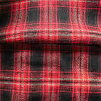 Close-up of Longan Craft’s Colorful One Side Sueded Flannel Fabric By The Yard, featuring a classic red and black yarn-dyed cotton plaid pattern with intersecting lines. The super snuggle fall flannel material appears slightly creased.