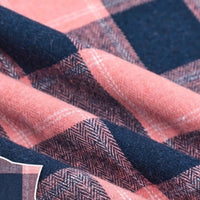 Close-up of Longan Craft Colorful One Side Sueded Flannel Fabric By The Yard, a super snuggle yarn dyed cotton plaid flannel material featuring a large dark blue and dusty pink pattern, with visible woven texture and soft, gentle folds.