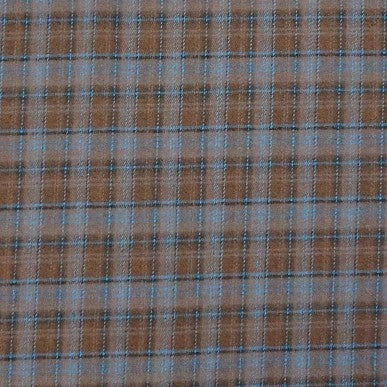 A close-up view of Longan Craft's Colorful Polyester Rayon Mammoth Flannel Fabric, featuring a brown base with blue and black plaid grid pattern—plaid brushed flannelette by the yard, perfect for snuggly apparel.