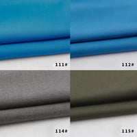 Four rayon polyester blend gabardine fabric swatches from Longan Craft are shown: bright blue (111#), sky blue (112#), gray (114#), and olive green (115#). Each heavyweight viscose swatch is folded on a white background.