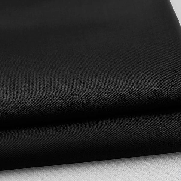 A close-up of neatly folded Longan Craft Colorful Rayon Polyester Blend Gabardine Fabric, a heavyweight viscose material with a smooth, slightly textured surface, displayed on a light background—ideal for DIY uniforms.