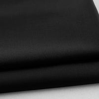 A close-up of neatly folded Longan Craft Colorful Rayon Polyester Blend Gabardine Fabric, a heavyweight viscose material with a smooth, slightly textured surface, displayed on a light background—ideal for DIY uniforms.