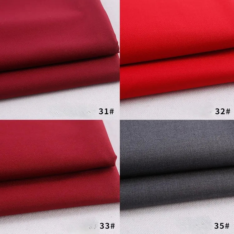Four samples of Longan Craft’s Colorful Rayon Polyester Blend Gabardine Fabric (deep red 31#, bright red 32#, wine red 33#, gray 35#) are neatly folded on a white background, showcasing this heavyweight viscose material for DIY uniforms.