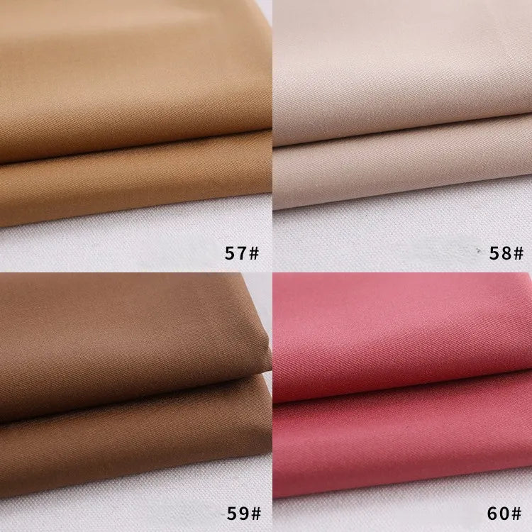 Four folded swatches of Longan Craft Colorful Rayon Polyester Blend Gabardine Fabric are shown in light brown (57#), beige (58#), dark brown (59#), and dusty rose pink (60#), each numbered at the bottom right corner.