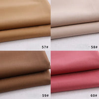 Four folded swatches of Longan Craft Colorful Rayon Polyester Blend Gabardine Fabric are shown in light brown (57#), beige (58#), dark brown (59#), and dusty rose pink (60#), each numbered at the bottom right corner.