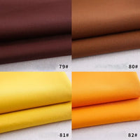 Four folded Longan Craft Colorful Rayon Polyester Blend Gabardine fabric swatches in brown, tan, yellow, and orange—numbers 79#, 80#, 81#, and 82# appear on the bottom right of each quadrant. Ideal for DIY uniforms.